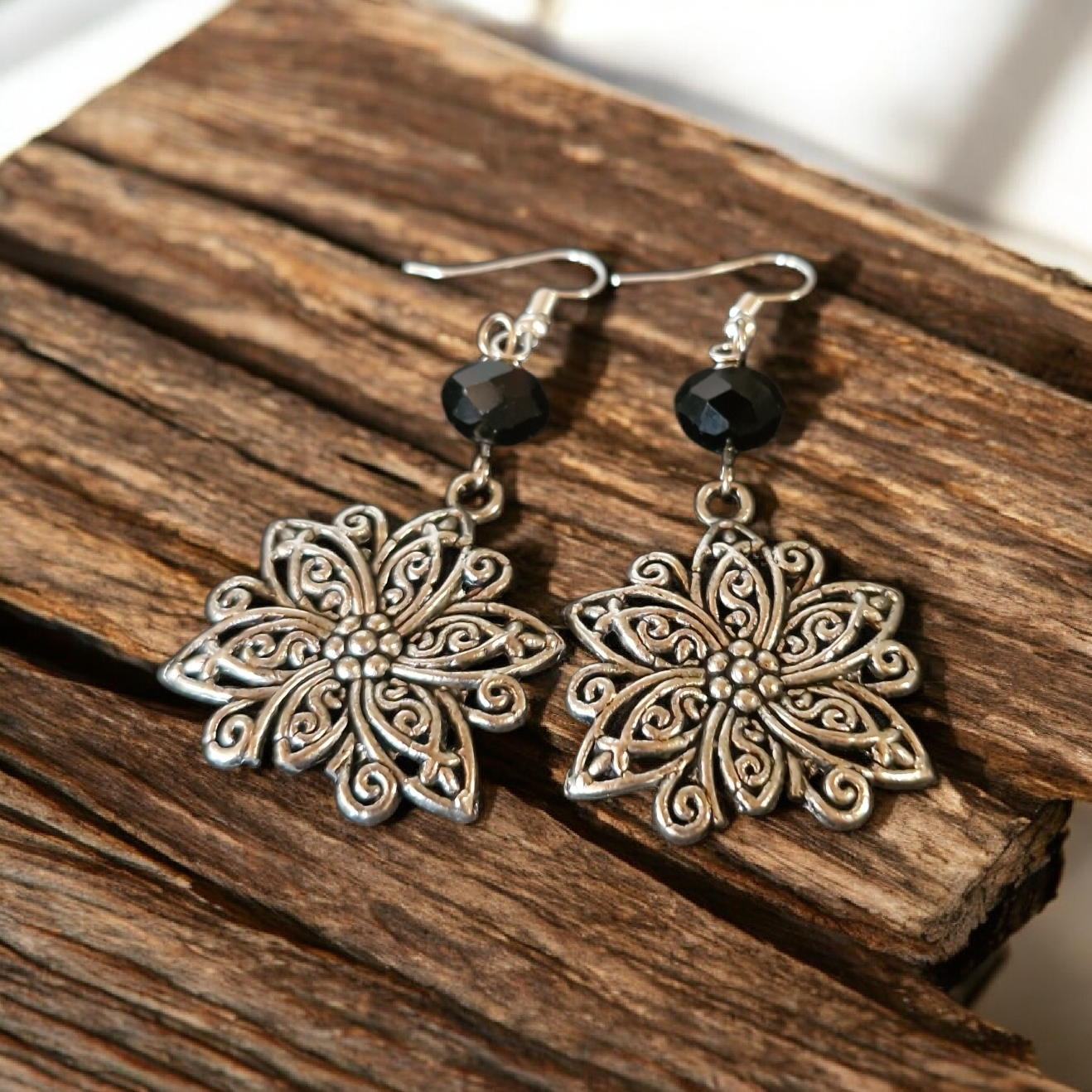 Dangle Earrings with black glass crystal and flower feature